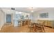 Bright dining area with glass table and kitchen access at 119 Tidewater Dr # 119, Bradenton, FL 34210