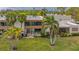 Back exterior view of condo with patio and lush landscaping at 119 Tidewater Dr # 119, Bradenton, FL 34210