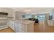Modern kitchen with white cabinets and quartz countertops at 119 Tidewater Dr # 119, Bradenton, FL 34210