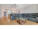 Living room with large sectional and wood floors at 119 Tidewater Dr # 119, Bradenton, FL 34210