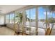 Sunroom with water views and ample natural light at 119 Tidewater Dr # 119, Bradenton, FL 34210