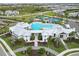 Community pool, tennis courts, and playground visible from above at 16714 Savory Mist Cir, Bradenton, FL 34211