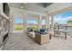 Relaxing covered patio with fireplace and comfortable seating near pool at 16714 Savory Mist Cir, Bradenton, FL 34211
