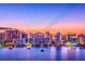 Stunning sunset view over the water with city skyline in the background at 2321 Hillview St, Sarasota, FL 34239