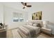 Bright bedroom with a queen-size bed and large window at 280 Hidden Bay Dr # 201, Osprey, FL 34229