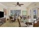 Community room features tables, chairs, and a large TV at 280 Hidden Bay Dr # 201, Osprey, FL 34229