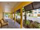 Covered patio with seating and views of the community at 280 Hidden Bay Dr # 201, Osprey, FL 34229