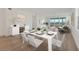 Open concept dining area with water views at 280 Hidden Bay Dr # 201, Osprey, FL 34229