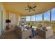 Relaxing lanai with water view and comfortable seating at 280 Hidden Bay Dr # 201, Osprey, FL 34229
