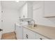 Bright laundry room with white cabinets and utility sink at 280 Hidden Bay Dr # 201, Osprey, FL 34229