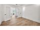 Open living room with hardwood floors and view of kitchen at 280 Hidden Bay Dr # 201, Osprey, FL 34229