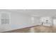 Spacious living room with hardwood floors and open floor plan at 280 Hidden Bay Dr # 201, Osprey, FL 34229