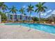 Refreshing community pool with lounge chairs and palm trees at 280 Hidden Bay Dr # 201, Osprey, FL 34229