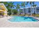 Inviting community pool with lounge chairs at 280 Hidden Bay Dr # 201, Osprey, FL 34229
