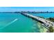 Aerial view of a coastal city with bridge and turquoise water at 3029 Homasassa Rd, Sarasota, FL 34239
