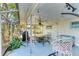 Covered patio with ceiling fan, fire pit, and seating at 3029 Homasassa Rd, Sarasota, FL 34239