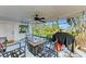 Covered patio with ceiling fan and grill at 3029 Homasassa Rd, Sarasota, FL 34239