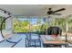 Covered patio with water view and hanging chair at 3029 Homasassa Rd, Sarasota, FL 34239