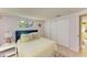 Cozy bedroom with sliding door and a charming decor at 3029 Homasassa Rd, Sarasota, FL 34239