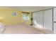 Cozy bedroom with a queen-size bed and sliding closet doors at 3029 Homasassa Rd, Sarasota, FL 34239