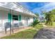 Front porch with teal shutters and seating at 3029 Homasassa Rd, Sarasota, FL 34239