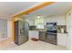 Modern kitchen with stainless steel appliances and white cabinets at 3029 Homasassa Rd, Sarasota, FL 34239