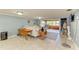 Bright living room featuring a comfy sectional sofa and tiled floors at 3029 Homasassa Rd, Sarasota, FL 34239