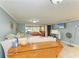 Living room with sectional sofa and view into the sunroom at 3029 Homasassa Rd, Sarasota, FL 34239