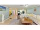 Spacious living area with sectional sofa and access to other rooms at 3029 Homasassa Rd, Sarasota, FL 34239