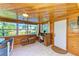 Charming sunroom with wood details and backyard access at 3029 Homasassa Rd, Sarasota, FL 34239