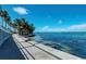 Scenic waterfront walkway with palm trees at 3029 Homasassa Rd, Sarasota, FL 34239