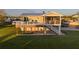 Elevated home with large deck, screened porch, and waterfront access at 4528 106Th W St, Bradenton, FL 34210