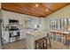 Modern kitchen with stainless steel appliances and island at 4528 106Th W St, Bradenton, FL 34210