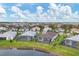 Aerial view of community with lake and homes at 4939 Surfside Cir, Bradenton, FL 34211