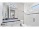 Modern bathroom with a walk-in shower and granite vanity at 4939 Surfside Cir, Bradenton, FL 34211