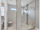 Modern bathroom featuring a large walk-in shower and marble tile at 4939 Surfside Cir, Bradenton, FL 34211