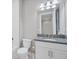 Clean bathroom with white cabinets and granite countertop at 4939 Surfside Cir, Bradenton, FL 34211
