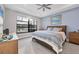 Relaxing bedroom with water views and a ceiling fan at 4939 Surfside Cir, Bradenton, FL 34211