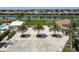 Aerial view of community with lake and lush landscaping at 4939 Surfside Cir, Bradenton, FL 34211