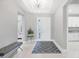 Bright and spacious entryway with modern chandelier and bench at 4939 Surfside Cir, Bradenton, FL 34211