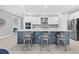 Bright kitchen with white cabinets, stainless steel appliances, and an island at 4939 Surfside Cir, Bradenton, FL 34211