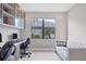 Home office with built-in desk and comfortable seating at 4939 Surfside Cir, Bradenton, FL 34211
