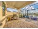 Covered patio with built-in grill and fire pit at 4939 Surfside Cir, Bradenton, FL 34211