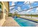 Enjoy this refreshing pool area with a covered lanai at 4939 Surfside Cir, Bradenton, FL 34211