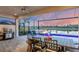 Outdoor kitchen and dining area with pool view at 4939 Surfside Cir, Bradenton, FL 34211