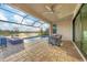 Relaxing pool area with covered patio and lake view at 4939 Surfside Cir, Bradenton, FL 34211