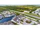 Aerial view of waterfront home with community pool and lush landscaping at 502 Woodstork Cir, Bradenton, FL 34209
