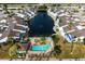 Community overview featuring pool, pond, and various homes at 502 Woodstork Cir, Bradenton, FL 34209