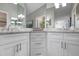 Elegant bathroom with corner double vanity and granite countertops at 502 Woodstork Cir, Bradenton, FL 34209