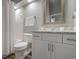 Modern bathroom with white vanity, granite countertop, and shower/tub at 502 Woodstork Cir, Bradenton, FL 34209